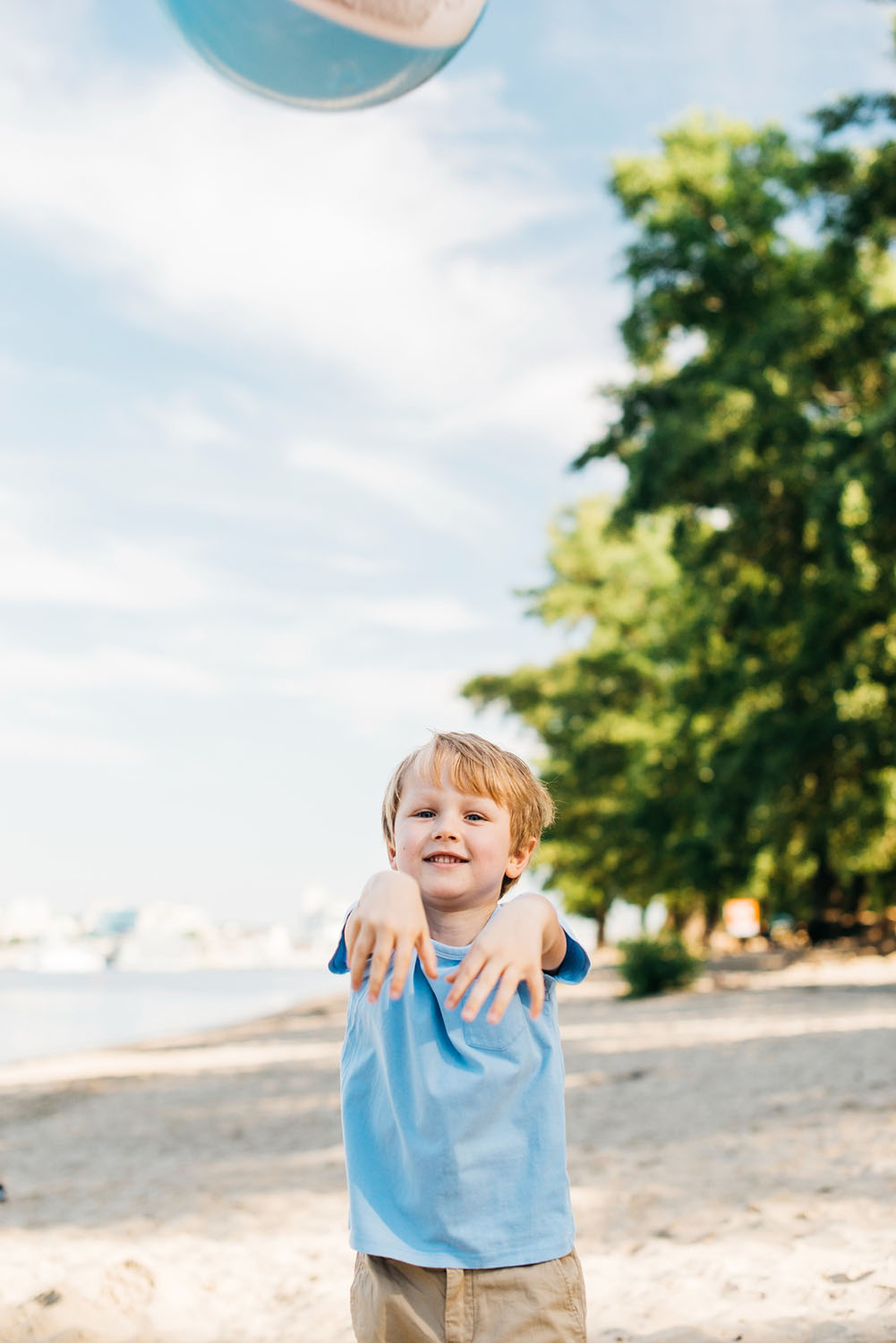 casual-boy-throwing-beach-ball casual-boy-throwing-beach-ball