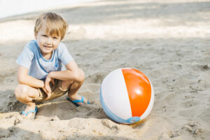 playful-kid-sitting-wind-ball playful-kid-sitting-wind-ball